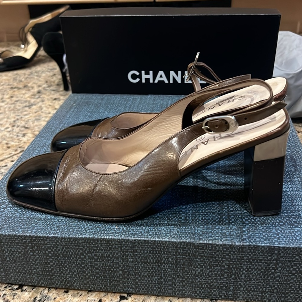 Chanel brown leather and black patent toe with metal hardware Chanel logo